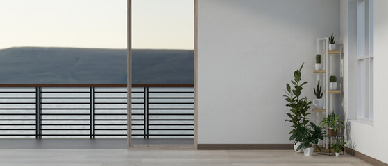 A modern empty apartment room interior design with a large glass window through a balcony.