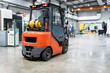 © Westend61 - Forklift in front of machinery at industry
