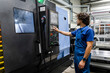 © Westend61 - Technician operating and programming metal robotic machinery