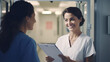 © Vahid - medicine, healthcare and people concept - female doctor with clipboard talking to smiling woman patient at hospital