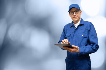 Poster - Man with a digital tablet. Serviceman, worker, engineer