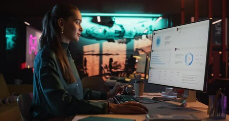 Aufkleber - Female Talented Digital Marketing Specialist Working on Computer at Office in the Evening. Young Caucasian Businesswoman in Creative Agency, Smiling and Researching Business Analytical Data
