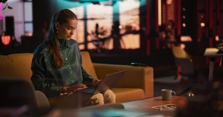 Poster - Portrait of White Creative Young Woman Working on a Laptop in Creative Office at Night. Female Team Lead Smiling While Checking her Team Performance Data, Sending Emails of Feedback