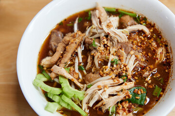 Instant noodles with braised chicken meat and in a bowl