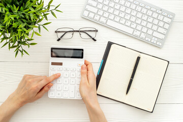 Wall Mural - Business accounter working place with taxes and calculator