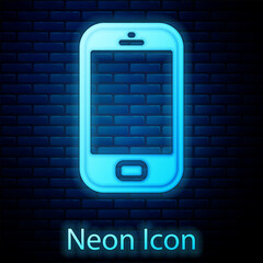 Sticker - Glowing neon Smartphone, mobile phone icon isolated on brick wall background. Vector