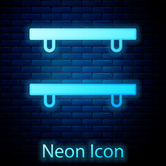 Canvas Print - Glowing neon Empty wooden shelves icon isolated on brick wall background. Vector