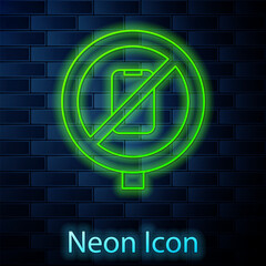 Sticker - Glowing neon line No cell phone icon isolated on brick wall background. No talking and calling sign. Cell prohibition. Vector