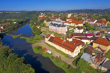 Wall Mural - The Sazava River and the town of Kacov with a brewery and a baroque castle on the river bank. Bohemia, Czech Republic