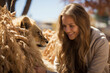 Beautiful young woman with long curly hair and big lion