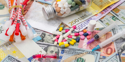 Wall Mural - different pills on dollar and euro bills.