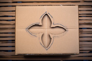 Poster - a detailed shot of a recycling symbol on a cardboard box