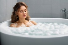 Attractive Young Woman Taking Bath With Foam. Concept Of Relaxation, Rest, Body Care. Generative AI