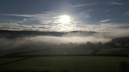 Wall Mural - Incredible sunrise scene over low-lying mist in the countryside