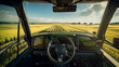 © MPA STUDIO - POV view from the cabin of a tractor harvesting rapeseed in a field. Modern tractor interior. Technological progress in farming, new efficient technologies, automated cultivation methods