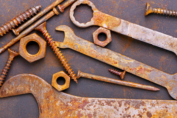 Wall Mural - old rusty repair tools on black background. Background of old rusty tools. The concept of workshop or repair 