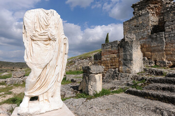 Headless statue wearing a toga, Roman ruins of Segobriga, Spain