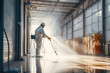 © SnowElf - Industrial building worker using a spray cleaner to clean surface. Creative concept of professional cleaning service for industrial enterprises.