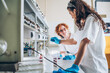 © BalanceFormCreative - In a chemistry lab, two diligent workers conduct experiments, kindling their passion for science and discovery.