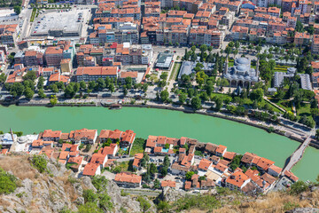 Amasya, Turkey - july 22, 2023 : Old Ottoman houses panoramic view by the Yesilirmak River in Amasya City. Amasya is populer tourist destination in Turkey.