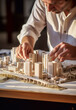 © Giordano Aita - The close-up of an architect who is making a model for a real estate project