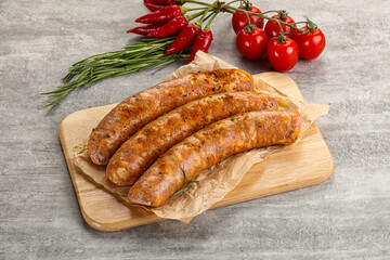 Raw sausages with spices and herbs