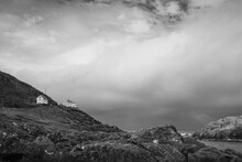 Cloudy Summer Morning At Krakenes Lighthouse Beach In Måløy: Black And White Landscape