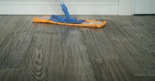 A Mop Deftly Glides Across The Floor, Efficiently Removing Dirt And Grime. In A Choreographed Dance, The Tool And Water Work Together To Leave A Trail Of Cleanliness In Their Wake.