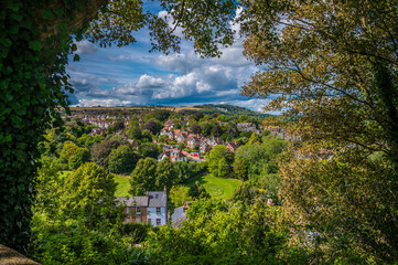 Wall Mural - A tree framed view west from the upper levels of the castle keep in Lewes, Sussex, UK in summertime