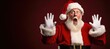 © JJAVA - Shocked Santa Claus on a Red Banner with Space for Copy