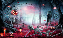 Halloween - Skeletons In Spooky Forest At Moonlight - Jack O’ Lanterns  In Cemetery At Twilight