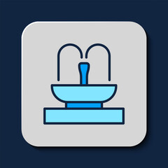 Poster - Filled outline Fountain icon isolated on blue background. Vector