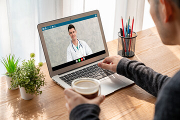 Doctor video call online by modish telemedicine software application for virtual meeting with patient