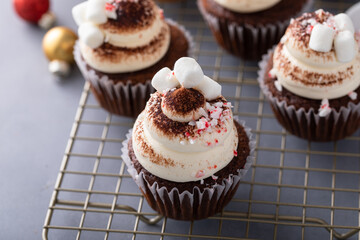 Wall Mural - Hot chocolate cupcakes with mini marshmallows, peppermint candy pieces and cocoa