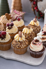 Wall Mural - Variety of Christmas cupcakes on a marble tray