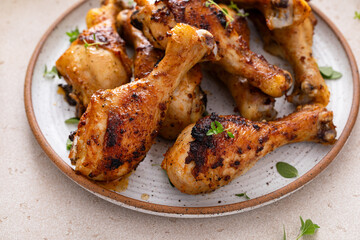 Wall Mural - Roasted chicken drumsticks with garlic and herbs