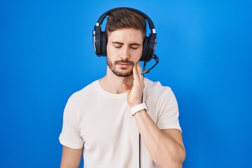 Poster - Hispanic man with beard listening to music wearing headphones touching mouth with hand with painful expression because of toothache or dental illness on teeth. dentist