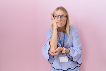 Sticker - Young caucasian business woman wearing id card thinking looking tired and bored with depression problems with crossed arms.