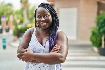 Sticker - African american woman standing with arms crossed gesture at street