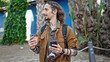 © Krakenimages.com - Young hispanic man tourist using smartphone holding coffee at park