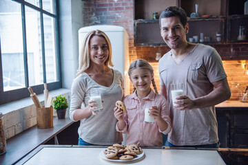 Wall Mural - Young family in kitchen