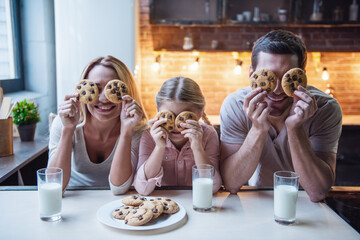 Wall Mural - Young family in kitchen