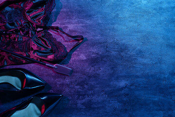 Wall Mural - Sexy underwear with whip and heels on dark background