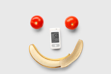 Wall Mural - Glucometer with tomatoes and banana on white background. Diabetes concept