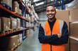 © ttonaorh - Smiling warehouse worker holding boxes in warehouse. This is a freight transportation and distribution warehouse. Industrial and industrial workers concept