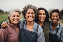 Smiling Portrait Of A Happy Group Of Middle Aged Female Farmers On A Farm Field
