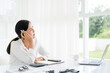© Fahng - thoughtful Asian business woman executive manager wearing shirt working in modern office, taking notes and thinking of professional plan, project management, considering new business ideas.