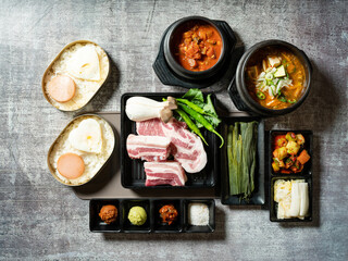 Poster - A set of various parts of raw pork, side dishes, and stew