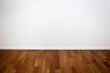 © VertigoBarrov - Empty white wall and wooden floor