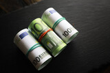 Fototapeta Młodzieżowe - 100 euro banknote pack and wood bankground. Currency, financial